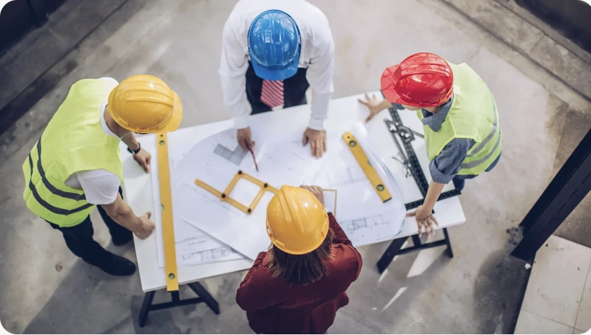 Construction team reviewing plans